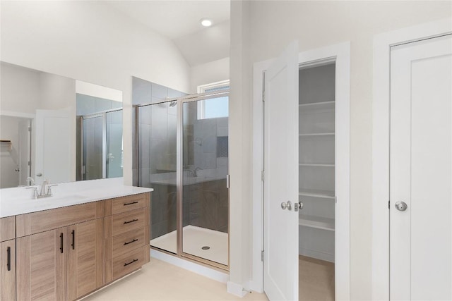 2705 Sage Ranch Dr Unit 22, Leander, TX 78641 - full bath featuring vanity, a shower stall, a walk in closet, and lofted ceiling