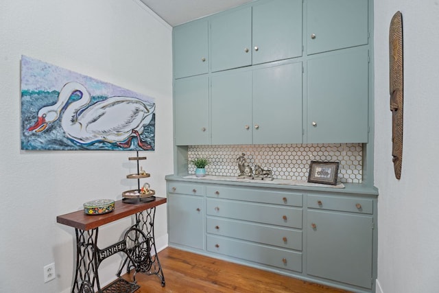 interior space featuring baseboards and wood finished floors