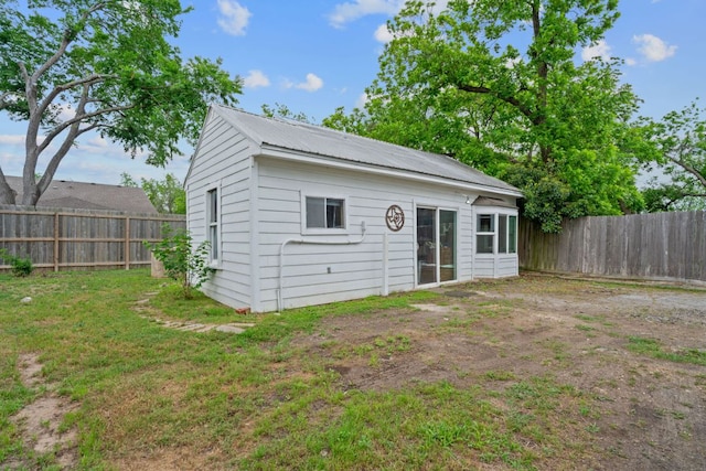 view of outbuilding featuring a fenced backyard