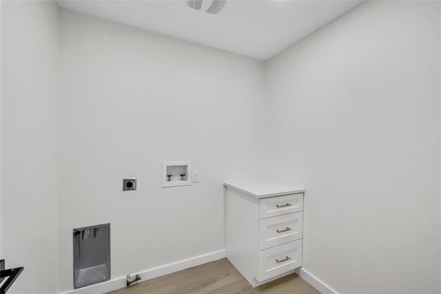 laundry area with laundry area, baseboards, hookup for a washing machine, light wood-type flooring, and hookup for an electric dryer