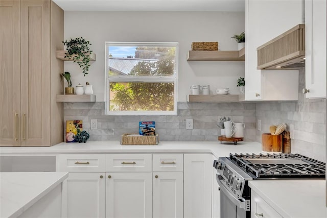 kitchen featuring white cabinets, open shelves, and gas stove