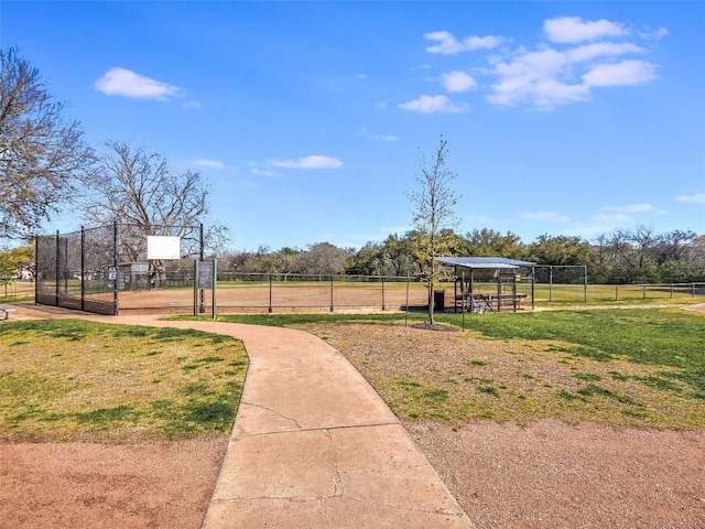 view of home's community with fence