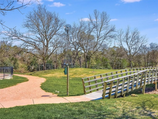 view of property's community featuring a yard