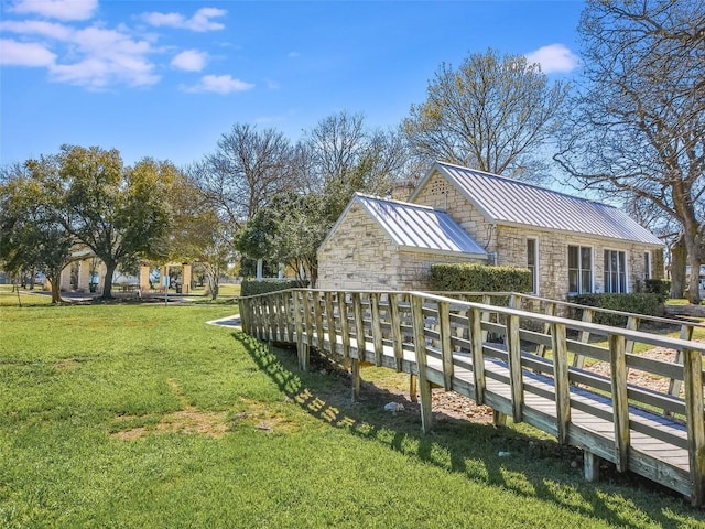 view of home's community with a lawn