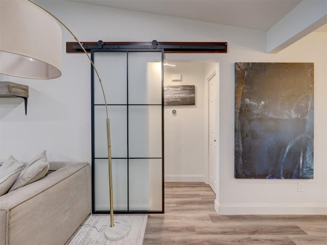 bathroom featuring wood finished floors and baseboards
