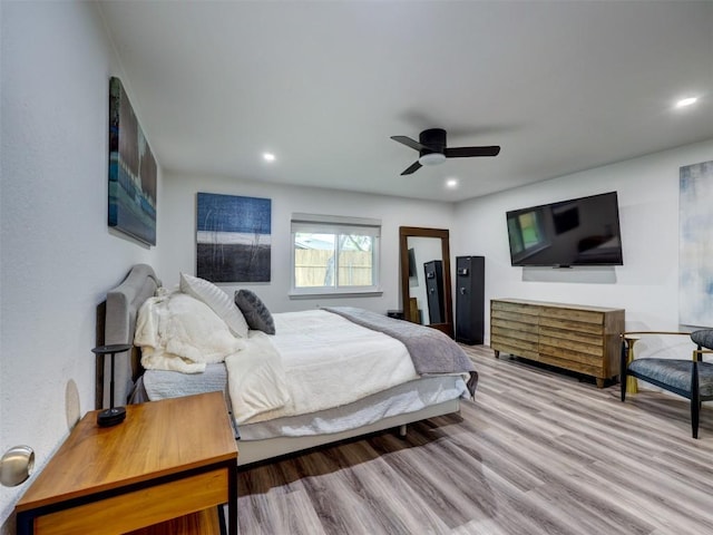 bedroom featuring wood finished floors, ceiling fan, and recessed lighting