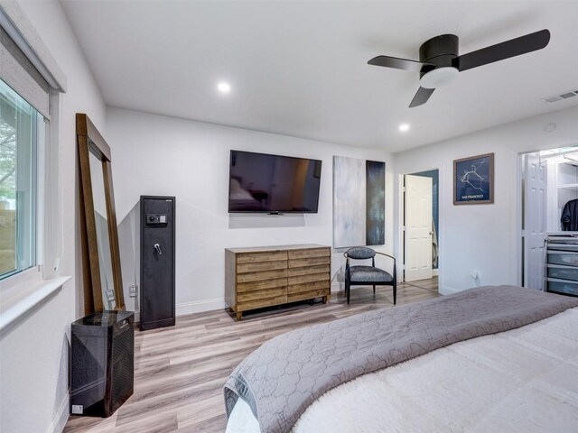 bedroom featuring wood finished floors, baseboards, recessed lighting, and a ceiling fan