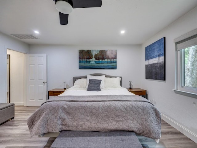 bedroom featuring wood finished floors, baseboards, a ceiling fan, and recessed lighting
