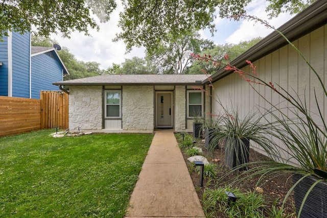 property entrance featuring stone siding