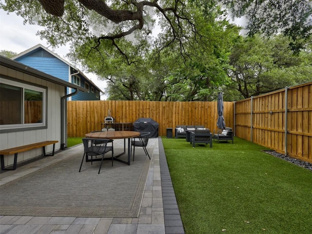 view of yard featuring a patio, outdoor dining area, and an outdoor hangout area