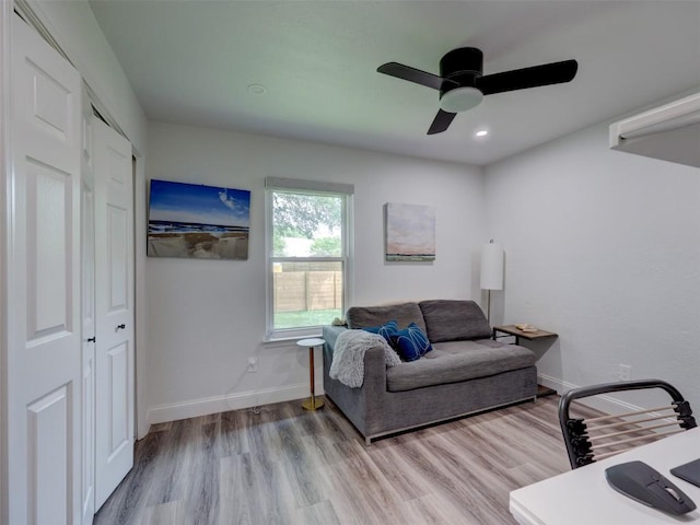living room featuring wood finished floors, ceiling fan, baseboards, and recessed lighting