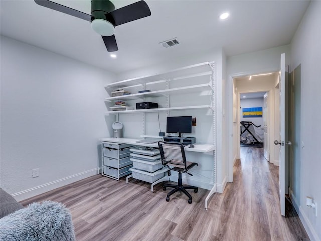 office with light wood-style floors, baseboards, a ceiling fan, and recessed lighting