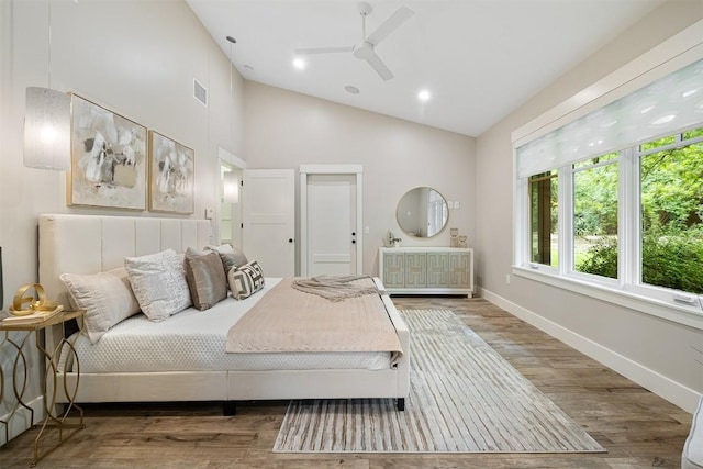 5517 Woodview Ave, Austin, TX 78756 - bedroom featuring baseboards, visible vents, wood finished floors, and high vaulted ceiling