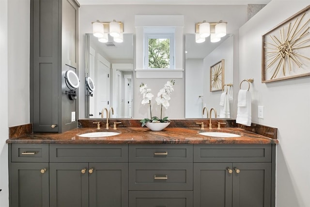 5517 Woodview Ave, Austin, TX 78756 - bathroom featuring double vanity, visible vents, and a sink