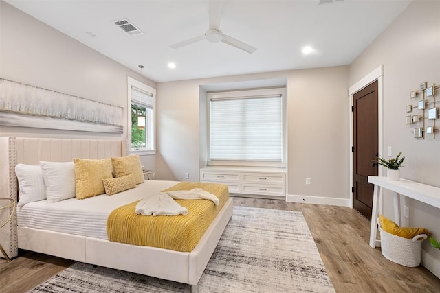 5517 Woodview Ave, Austin, TX 78756 - bedroom with visible vents, recessed lighting, baseboards, and wood finished floors