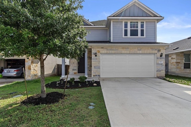 view of front of property with board and batten siding, concrete driveway, stone siding, and a garage