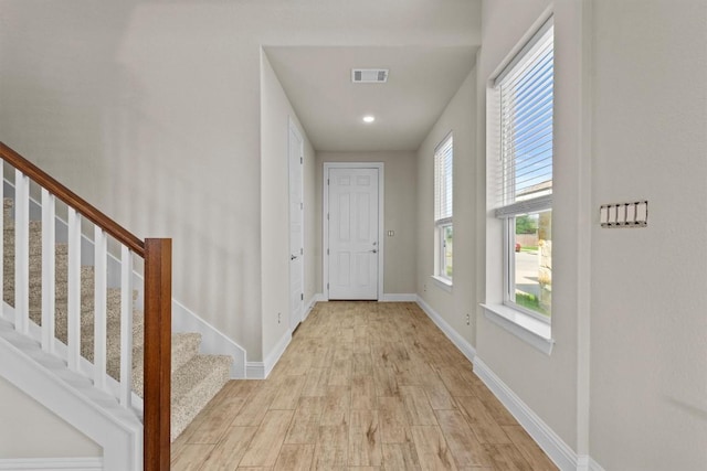 124 Oakstone Dr, Georgetown, TX 78628 - foyer entrance with stairs, light wood finished floors, and healthy amount of natural light