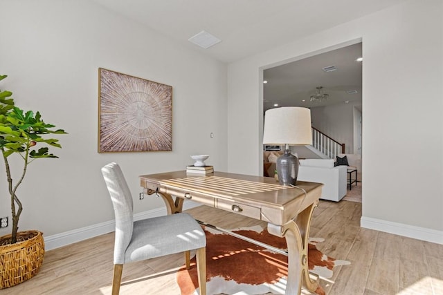 office featuring baseboards and wood finished floors