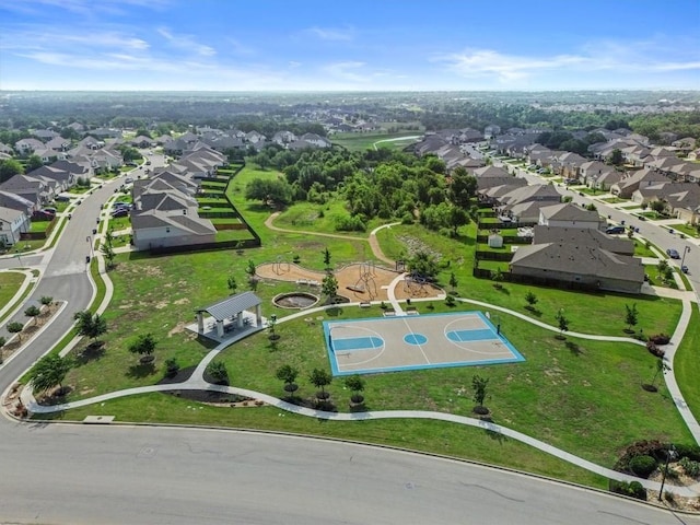 birds eye view of property with a residential view