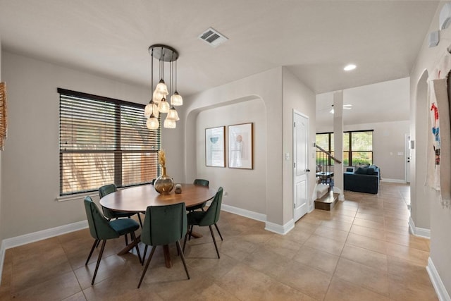 dining space with an inviting chandelier, recessed lighting, baseboards, light tile patterned floors, and visible vents