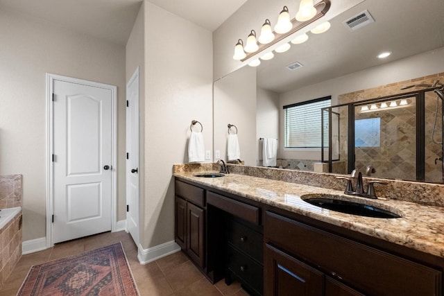 full bath featuring visible vents, a shower stall, and a sink