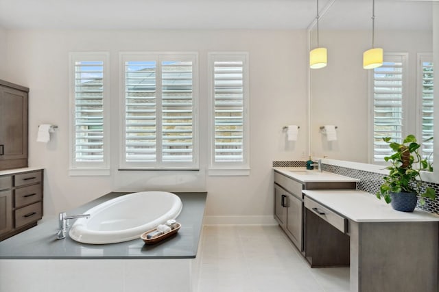 14108 Laurinburg Dr, Austin, TX 78717 - bathroom with vanity, a garden tub, tile patterned flooring, and backsplash