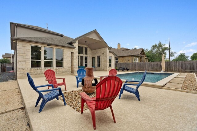 view of pool with a fenced in pool, a fenced backyard, and a patio area