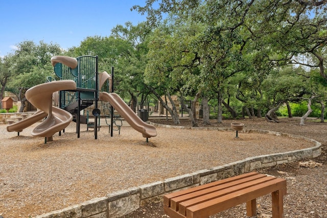 14108 Laurinburg Dr, Austin, TX 78717 - community jungle gym featuring view of wooded area