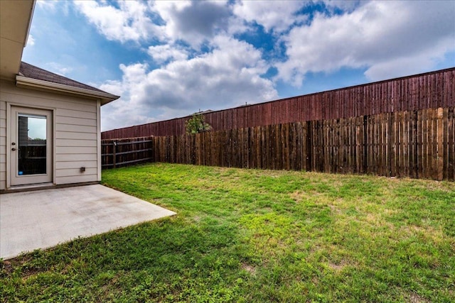 view of yard with a fenced backyard and a patio