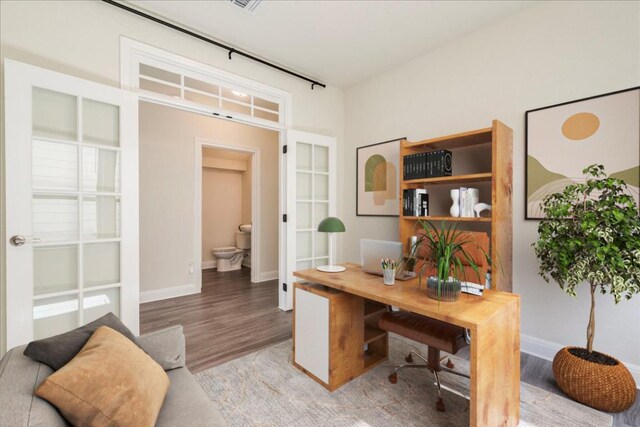 3209 Maysillee St, Austin, TX 78728 - home office featuring baseboards, french doors, and wood finished floors