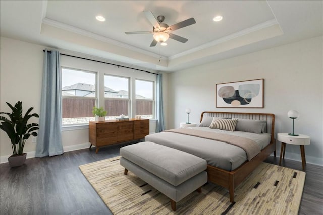 3209 Maysillee St, Austin, TX 78728 - bedroom featuring baseboards, crown molding, dark wood-type flooring, and a tray ceiling