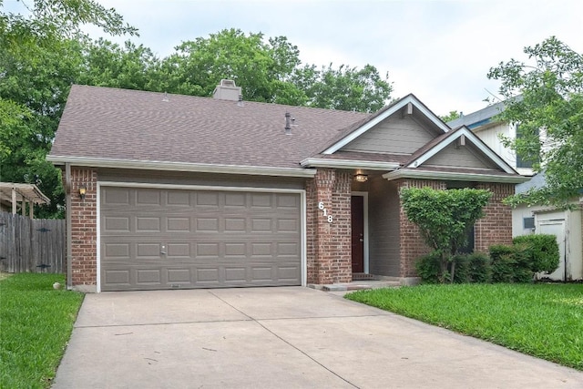 view of front of property featuring brick siding, a garage, fence, and concrete driveway
