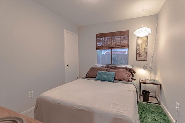 carpeted bedroom with baseboards