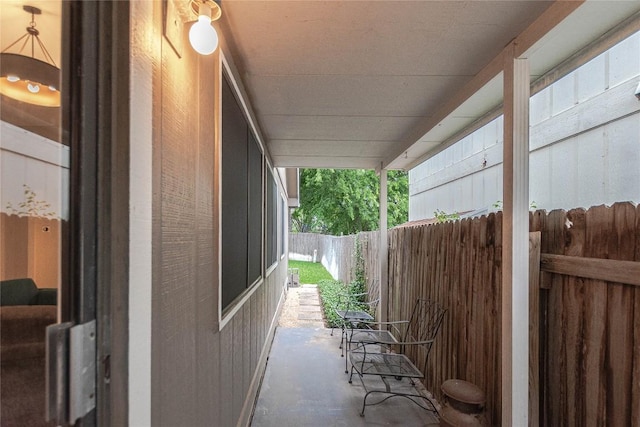 view of side of property featuring fence
