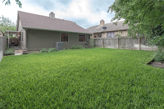 view of yard with a fenced backyard