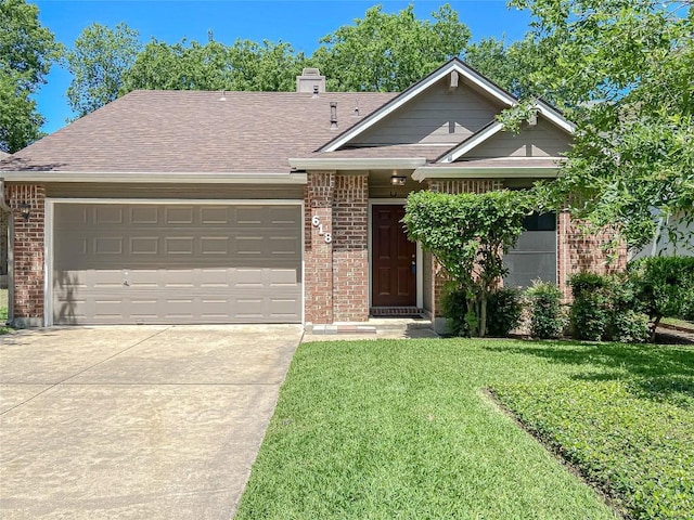 618 Smoke Signal Pass, Pflugerville, TX 78660 - view of front of house with brick siding, driveway, a front yard, and an attached garage
