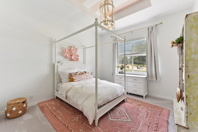 bedroom with baseboards and light colored carpet