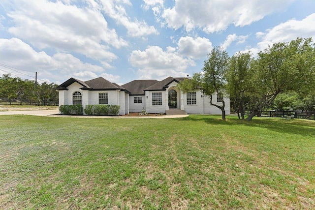 single story home with fence and a front yard