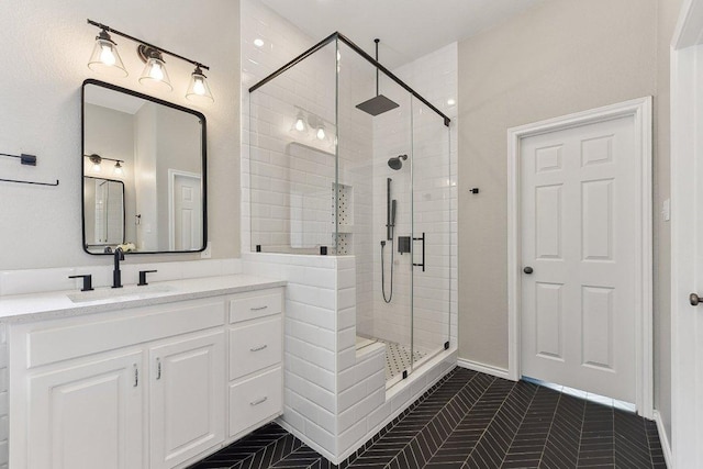 bathroom featuring vanity, tile patterned floors, and a shower stall
