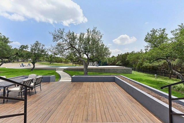 wooden deck with a lawn
