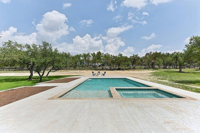 view of pool with a patio area, fence, and a yard