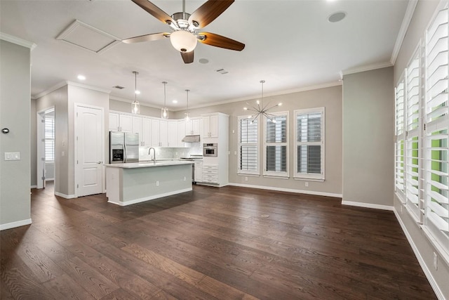 kitchen with a sink, appliances with stainless steel finishes, and a wealth of natural light