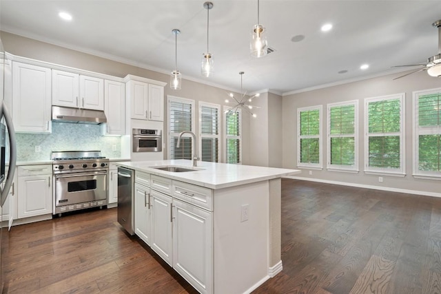 kitchen with light countertops, under cabinet range hood, white cabinets, a sink, and appliances with stainless steel finishes