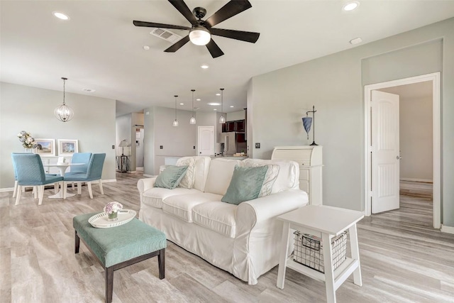 2224 Singletree Bnd, Georgetown, TX 78628 - living area featuring light wood-style flooring, ceiling fan, baseboards, and recessed lighting