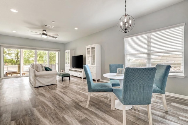 dining area with recessed lighting, baseboards, visible vents, and wood finished floors