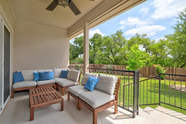 balcony featuring an outdoor living space and a ceiling fan