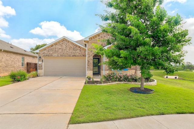 view of front of home with brick siding, a garage, a front lawn, and concrete driveway