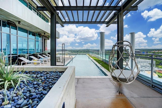 view of pool with a water view