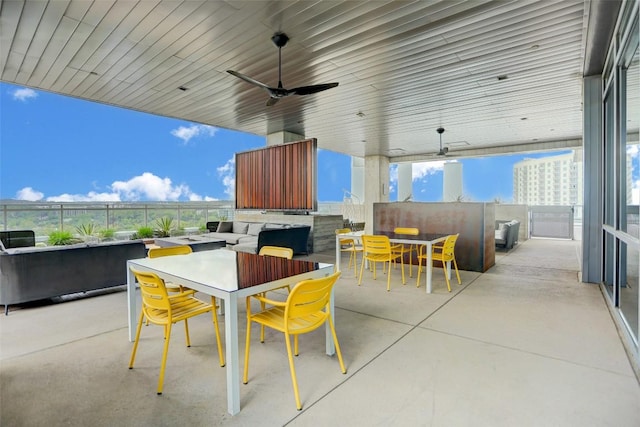 view of patio / terrace featuring ceiling fan, fence, and outdoor dining area