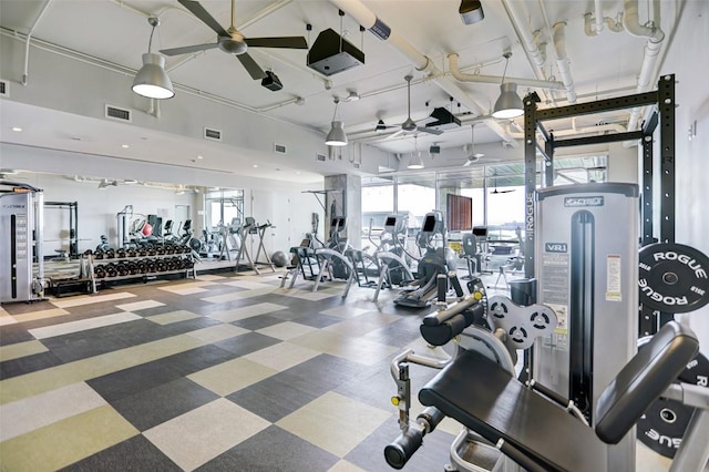 exercise room featuring tile patterned floors, a ceiling fan, and visible vents